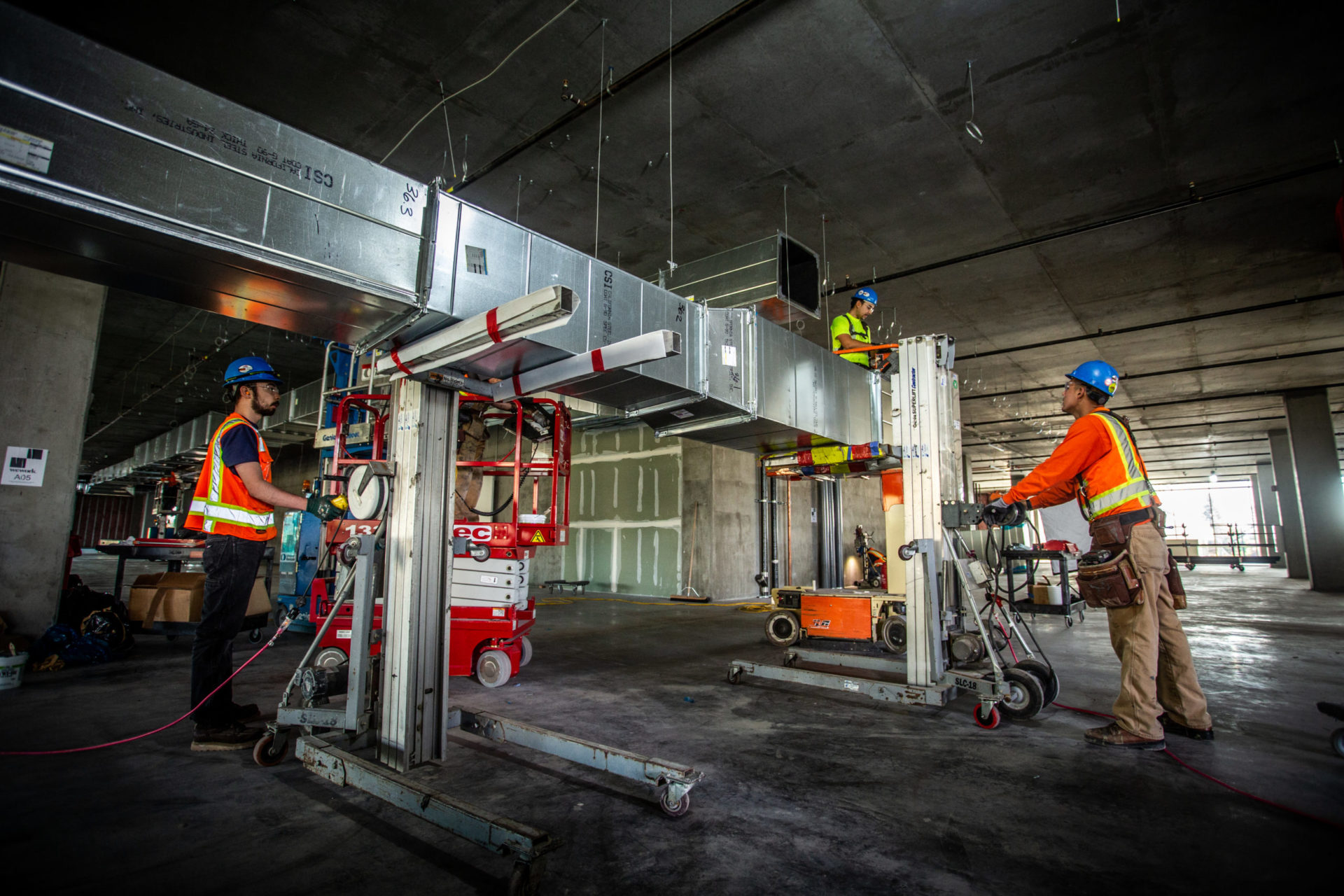 workers installing duct