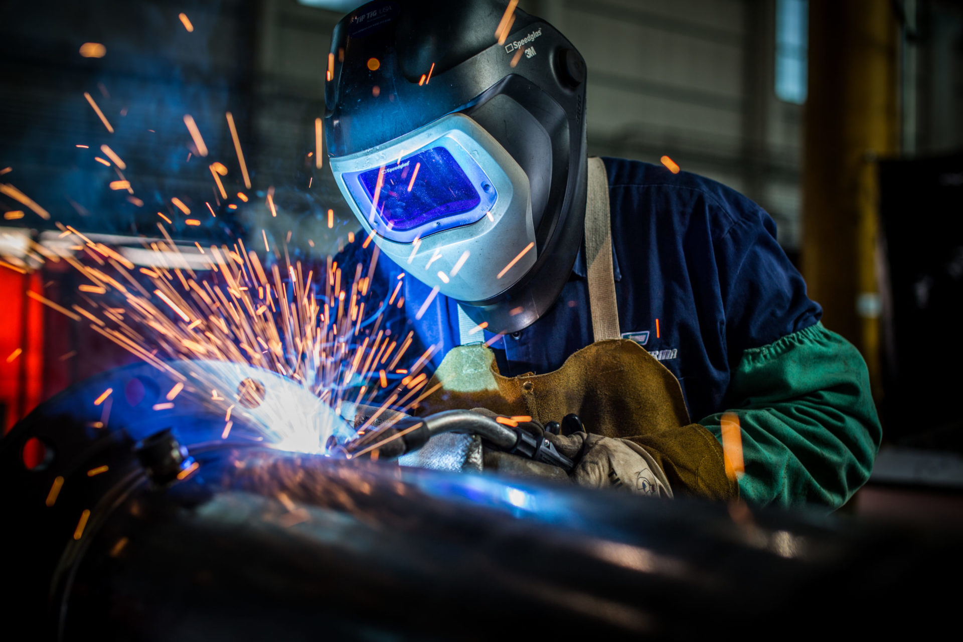 Worker welding parts