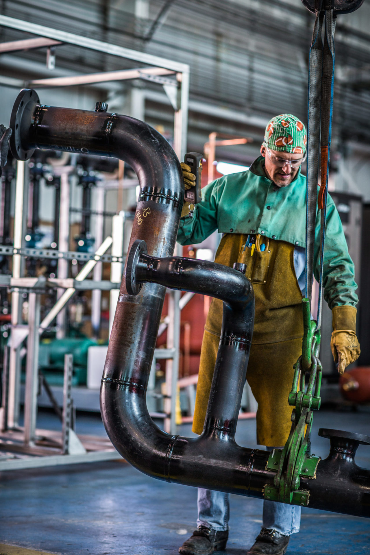 Worker installing metal parts