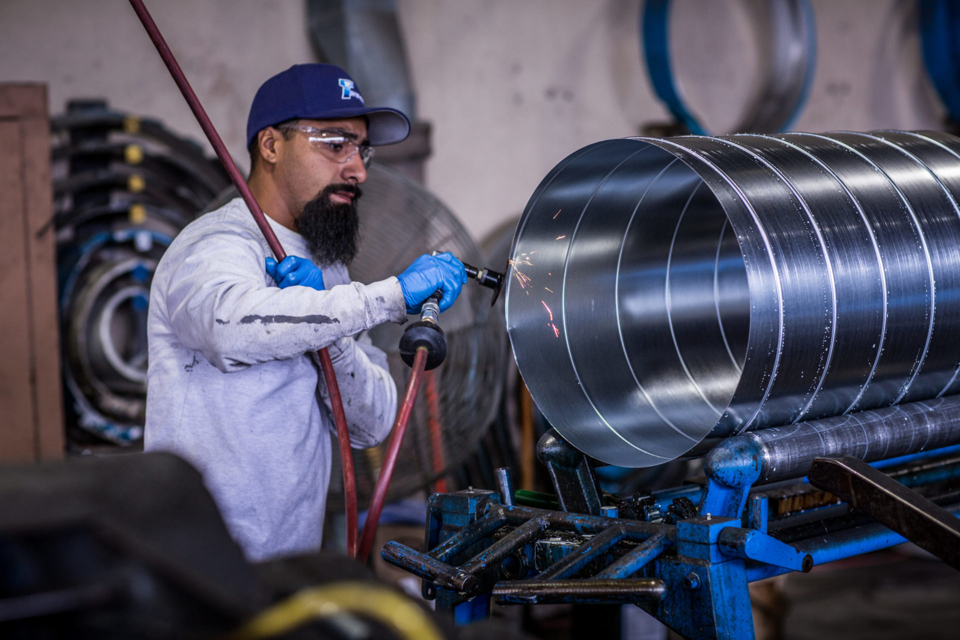 man working with metal duct