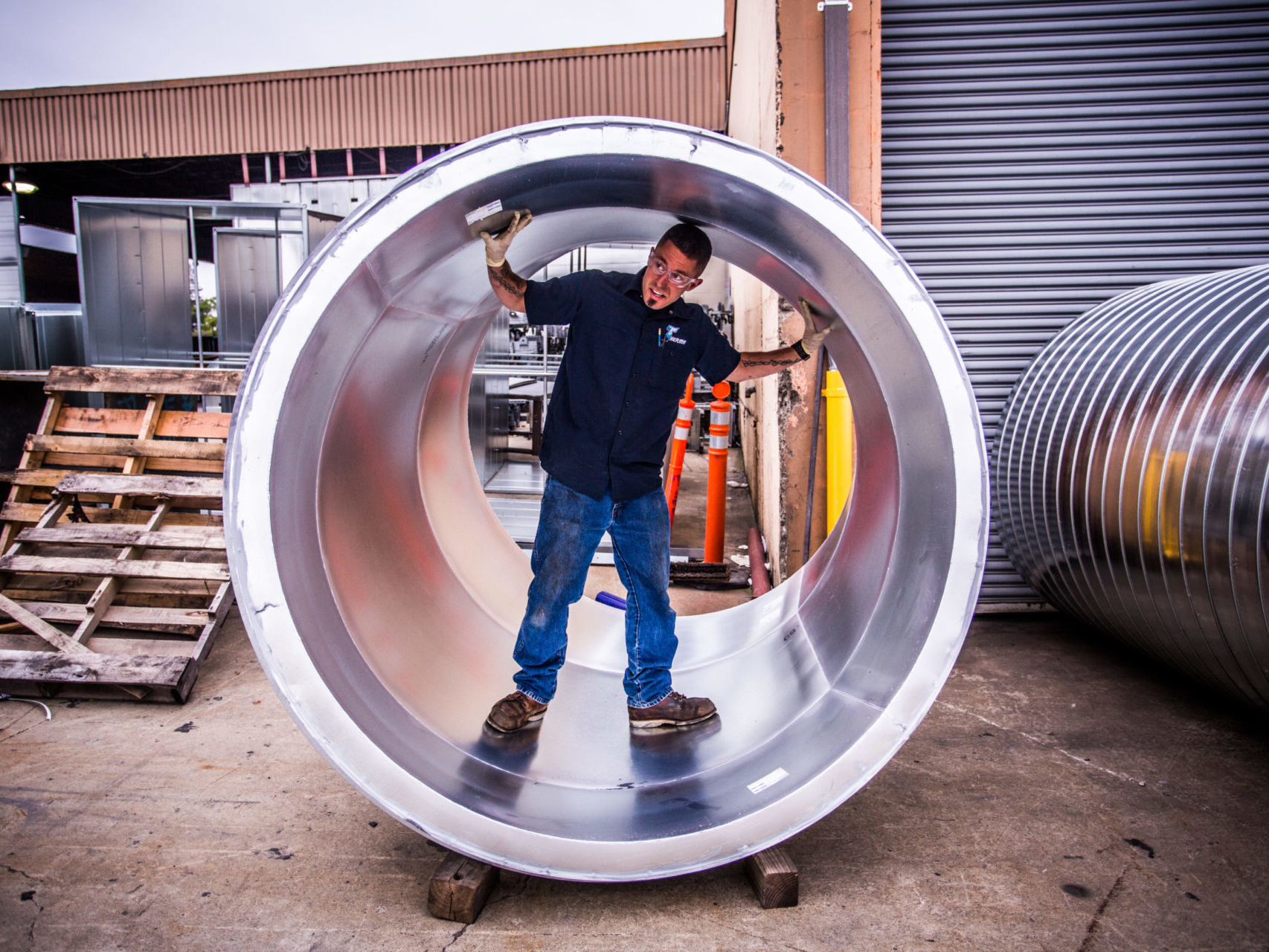 man inside metal pipe