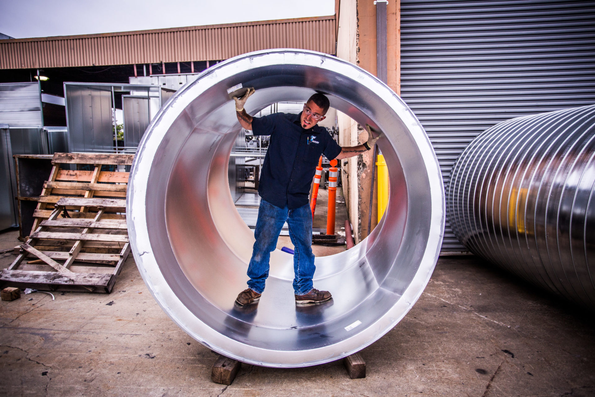 man inside metal pipe