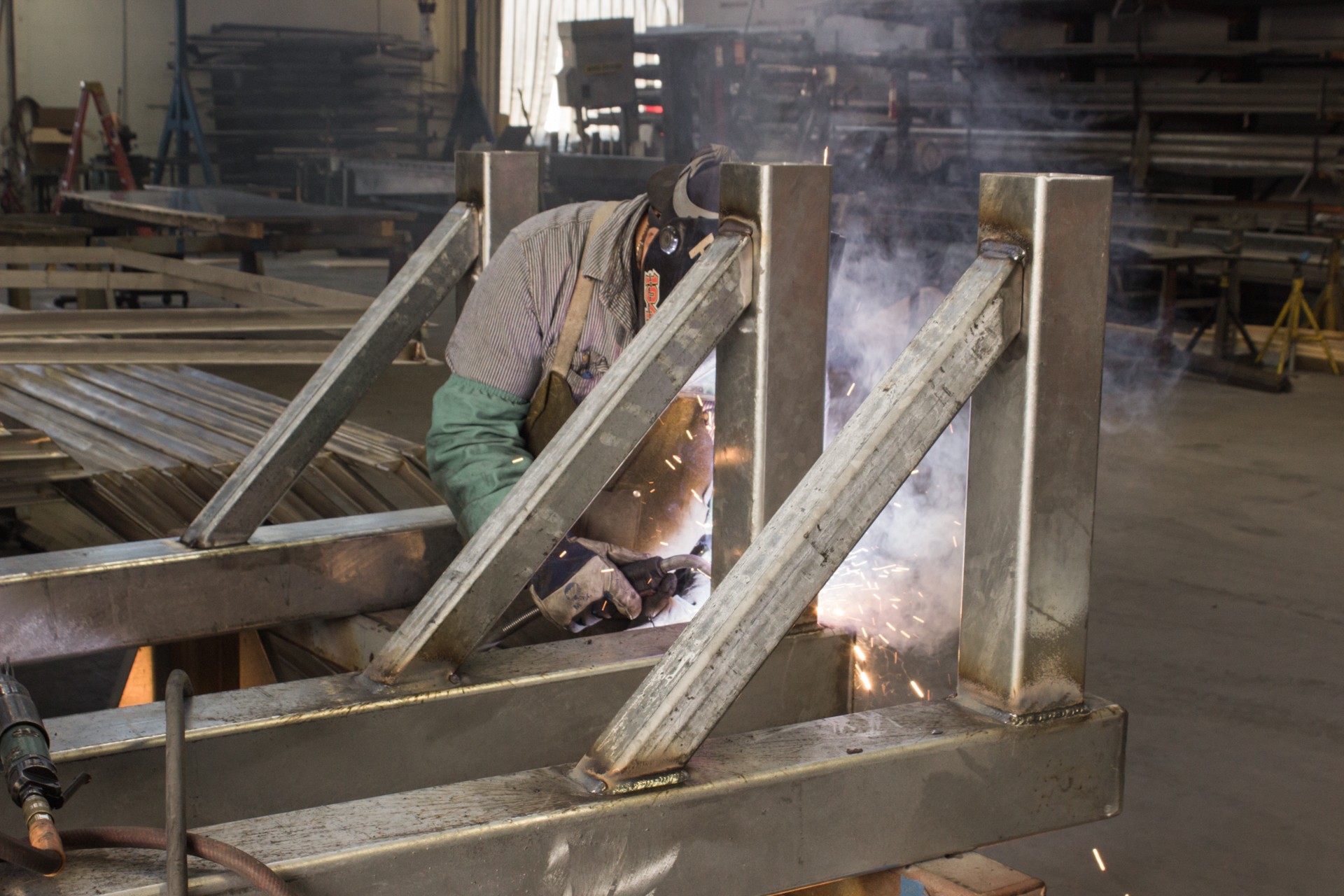 Worker welding metal parts