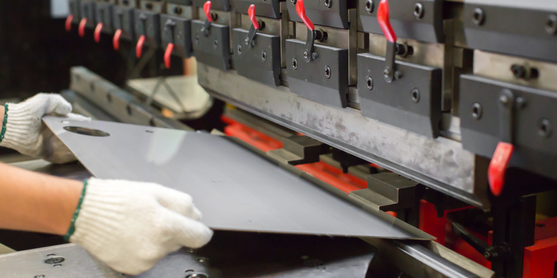 Worker bending Sheet Metal