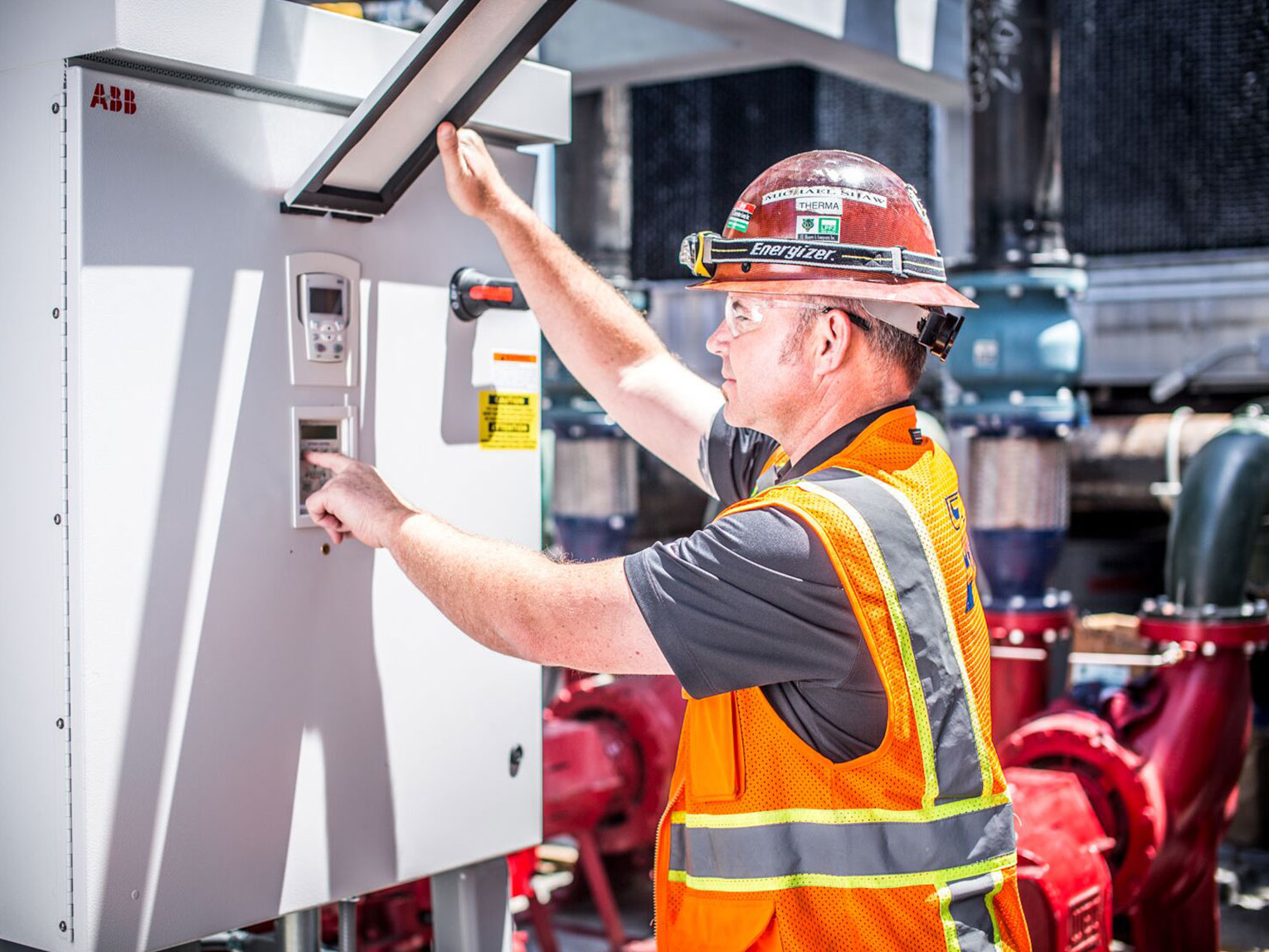 Worker pressing buttons in a box