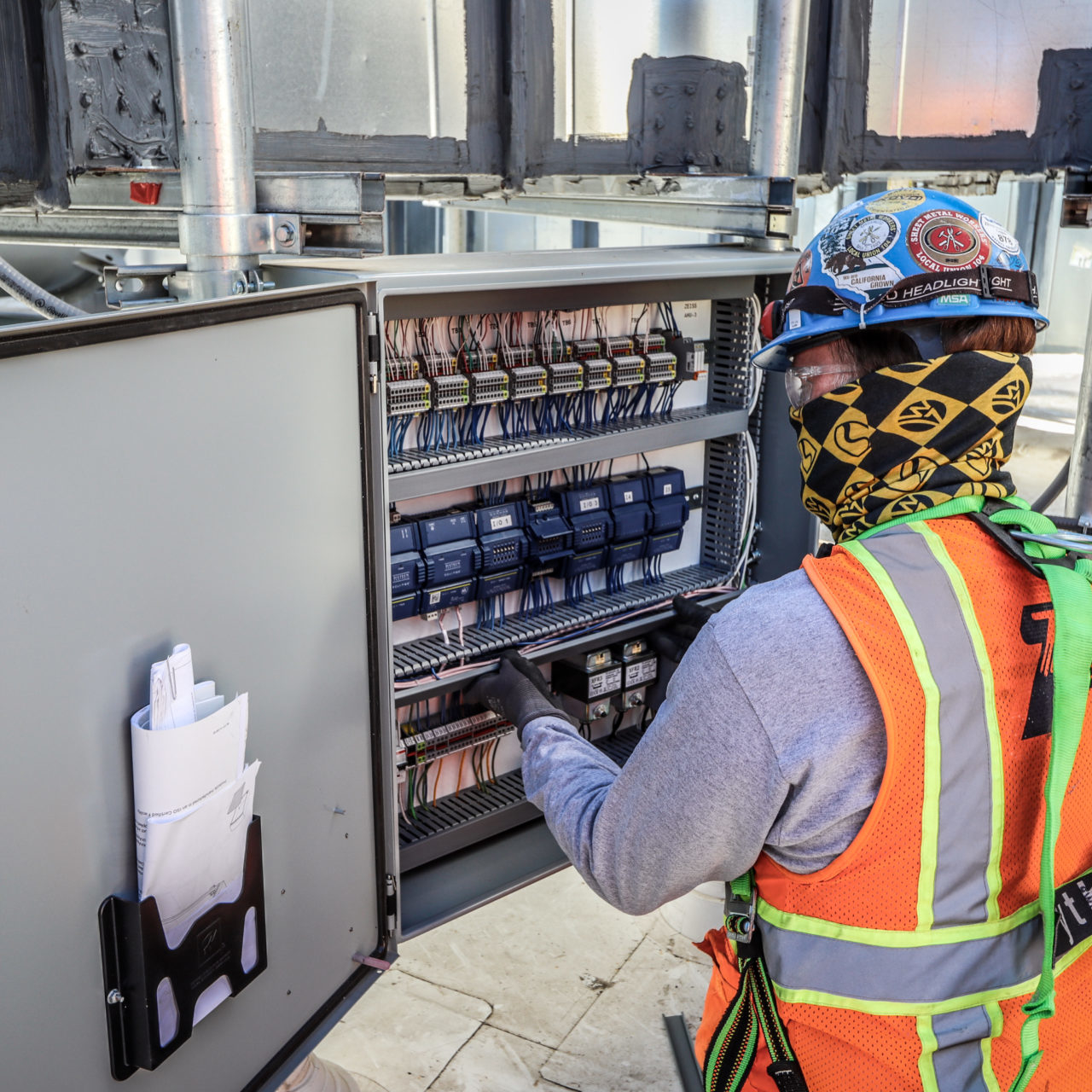 Operator working on automation system cables