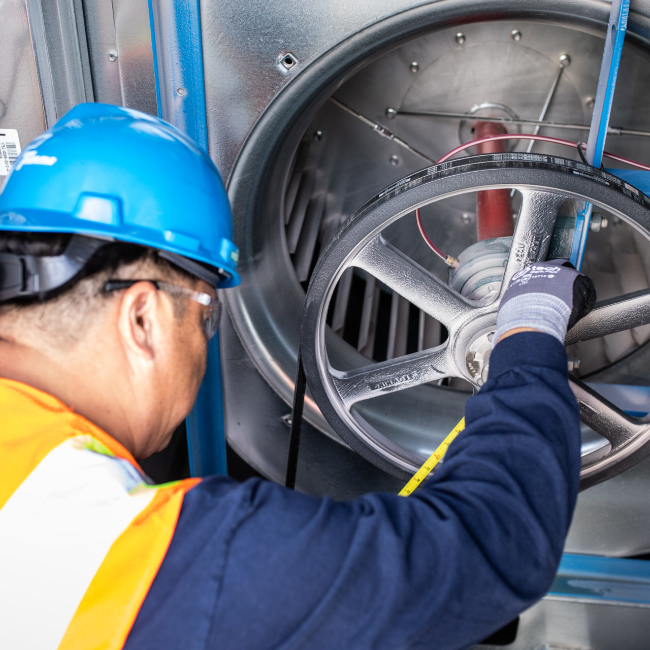 Therma worker working on machinery