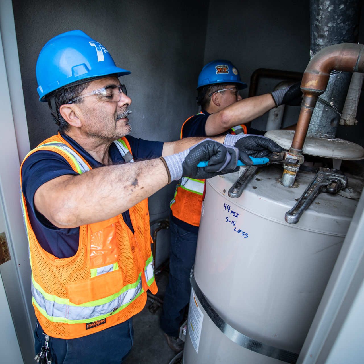 Two worker doing plumbing work